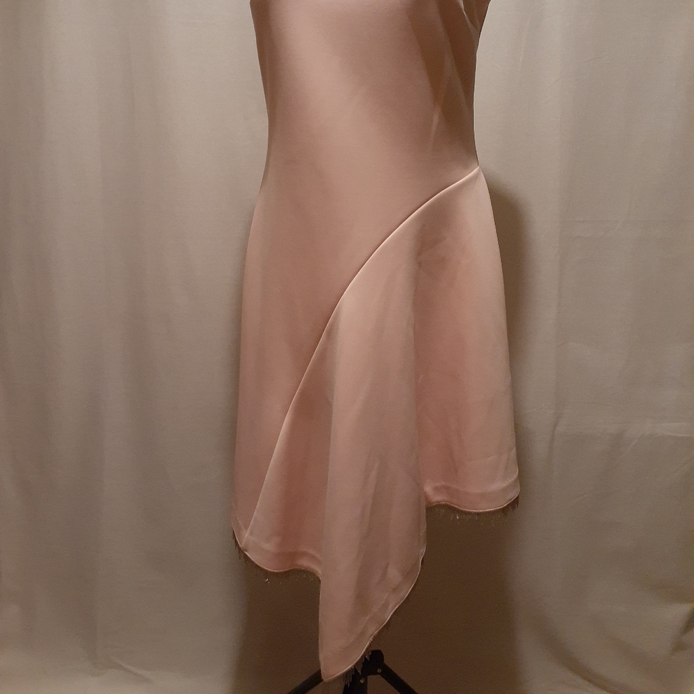 Kind of.  Asymmetrical fit & flare scuba Dress Med